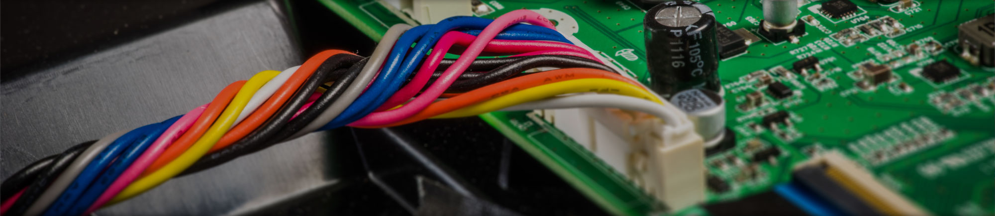 Wires plugged into printed circuit board in Farmington Hills, MI. 